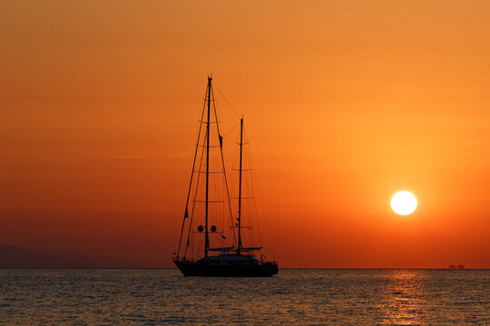 Sailing yacht silhouette at sunset, Antibes, French Riviera .
