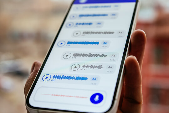 A person recording voice messages in a messenger.