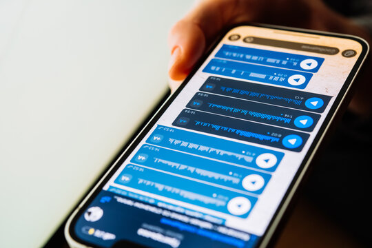 A person recording voice messages in a messenger.