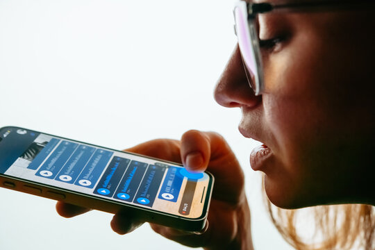 A person recording voice messages in a messenger.
