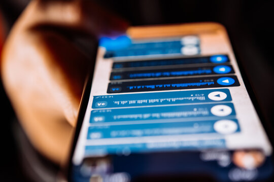 A person recording voice messages in a messenger.