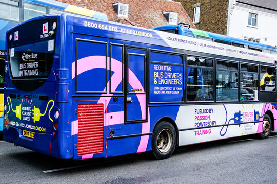Close-Up Of A First Bus Electric Singler-Decker Bus  Featuring L-Plates And Driver Training Signage On A Public Road