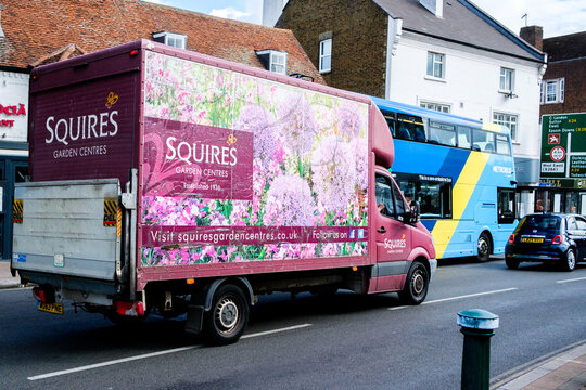 A Squires Garden Centre Box Van With A Hydraulic Tail Lift Driving On A Town Centre Main Road