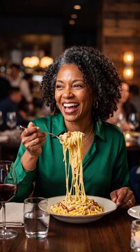 Successful Mature Woman Enjoying Gourmet Pasta