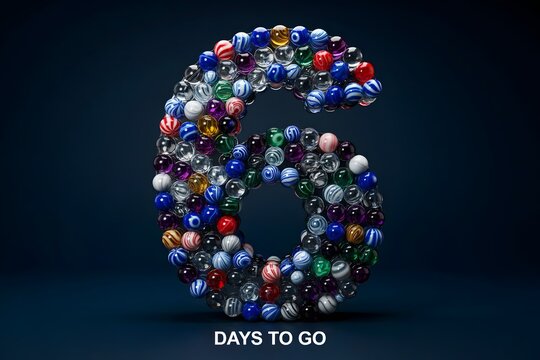 Number six made of colorful glass marbles with text days to go on a dark blue background