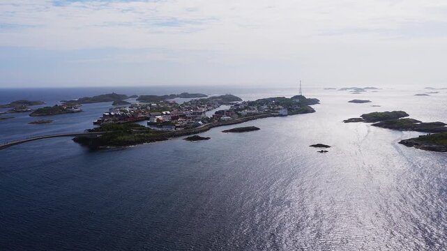 Aerial view of the coastal village of Henningsvaer situated across small islands connected by bridges in the Lofoten archipelago, Norway.
