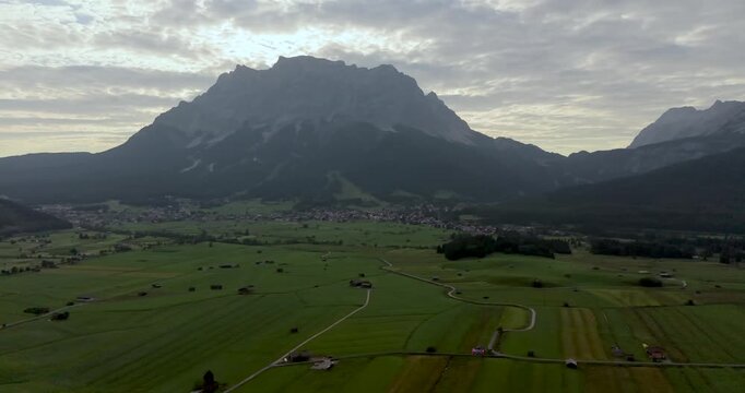 Drone panorama over Ehrwald valley toward Zugspitze in Tyrol Austria