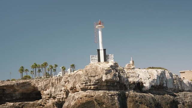 Small lighthouse on a rocky Mallorca headland