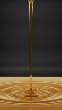 Smooth Pouring Stream of Golden Cooking Oil creating Splash and Ripples on Dark Background