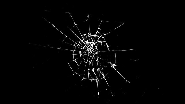 Broken cracks glass fracture effect texture isolated abstract background. Broken glass on black background. Glass is breaking. Dynamic explosion of a glass shattering on green screen  