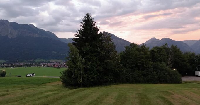 Evening drone flight over Oberstdorf with Bavarian Alpine mountains