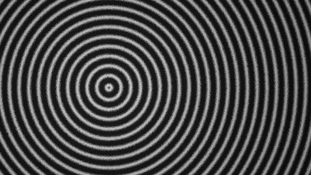 Black and white concentric circles forming an optical illusion pattern