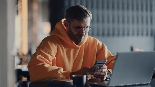 Internet Addiction And Gadgets Overuse, Modern Man With Smartphone And Laptop In Cafe