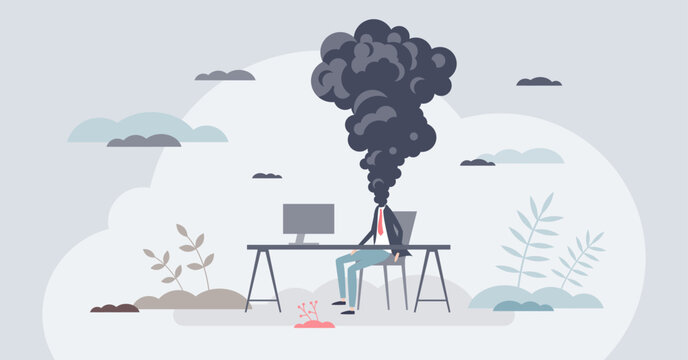 Emotional exhaustion at work, a burned out worker with smoke cloud head sits at a desk and computer, symbolizing overload and fatigue. Tiny style