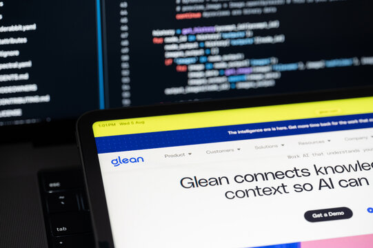 Glean Ai company web page on program code background