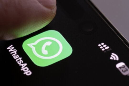 Finger press Whatsapp app icon