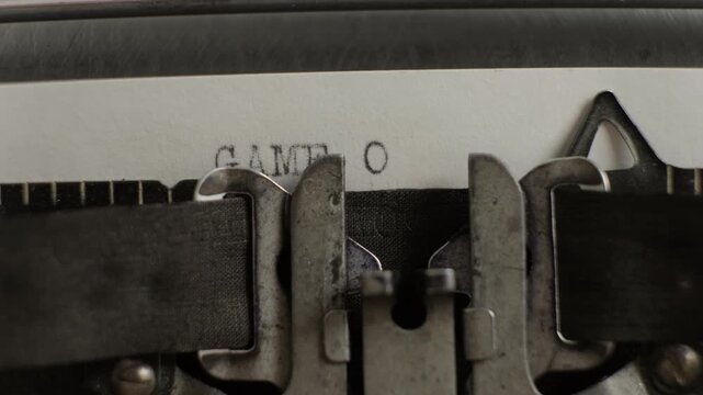Game over being typed on old vintage typewriter on white sheet of paper close-up