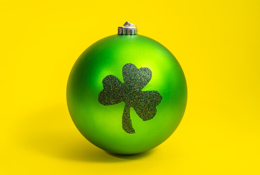 decoration ball for St. Patrick's day on yellow background