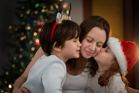 Portrait of mother son daughter celebrate christmas together