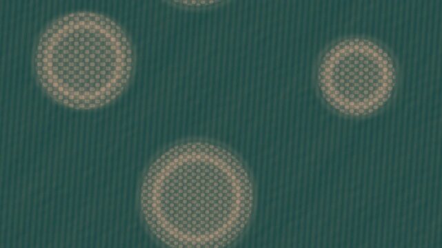 Peach and teal stencil overprint circles with tactile halftone texture