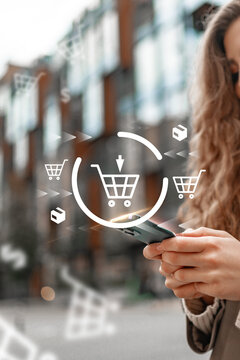 Shopping online with a smartphone in a city setting during daylight hours