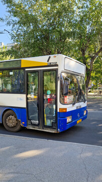 White and blue Mercedes-Benz O 405 city bus from the 1980s and 1990s on a city street in Barnaul a classic German public transport bus - Altai, Siberia, Russia 25.05.2025