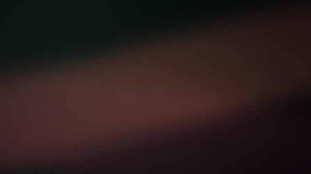 Abstract dark background with soft gradient transitions of brown and black