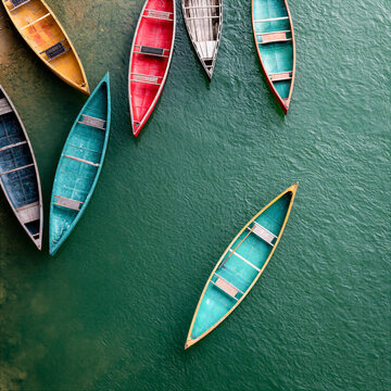concept image of boats or canoes on a river overhead drone camera view