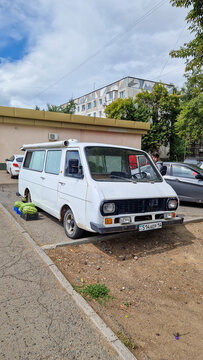 White RAF-2203 Latvija minibus from the 1980s, serving as a mobile sales stand for watermelons and parked in Pavlodar; a classic Soviet vehicle, Pavlodar Region, Kazakhstan 11.08.2025