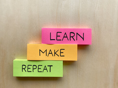 Colorful stacked blocks reading &ldquo;Learn Make Repeat,&rdquo; representing continuous learning, creativity, practice, personal development and improvement.