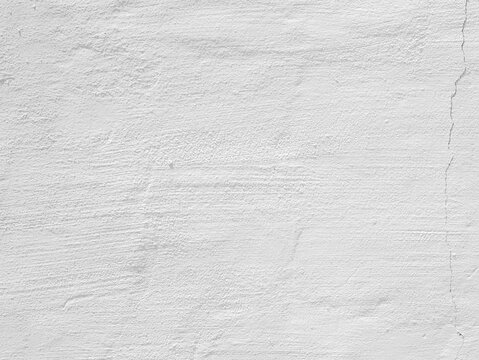 Subtle white plaster wall texture with natural surface marks