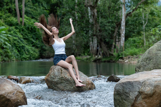Young Woman Recharging Herself in Nature