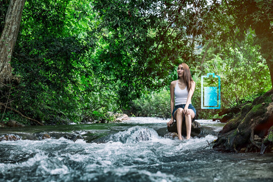 Young Woman Recharging Herself in Nature