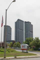 Naklejka premium sign outside driveway to OTT Financial Group (1123 Leslie St) with view of 1 crosstown condo, North York, Toronto