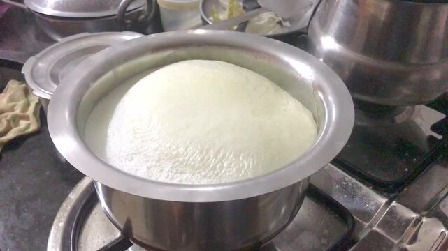 Milk Boiling and forming milk skin or lactoderm. Hot milk rising up