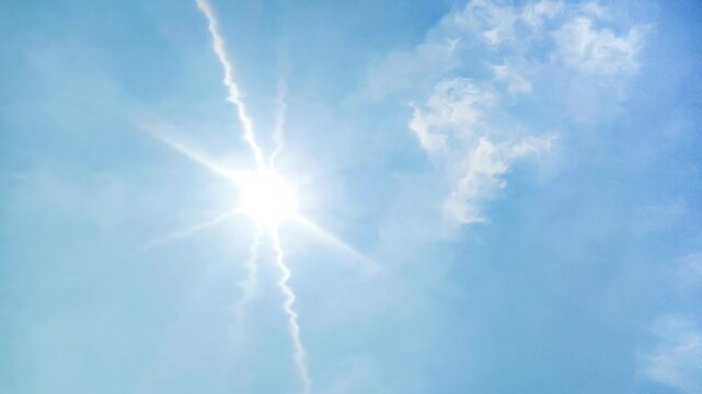 blue sky background and shining sun. Heat wave concept. Extreme weather. Global warming effects