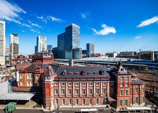 Aerial view of Tokyo Station and skyscrapers with blue sky, Japan