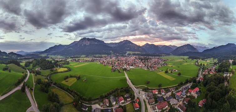 Aerial panorama of Oberstdorf under dramatic evening clouds