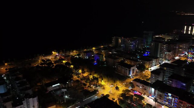 Aerial drone view of Alanya, Turkey at night, featuring the illuminated Mediterranean coastline, city lights, beachfront, urban landscape and night resort atmosphere.
Night aerial view of Alanya on th