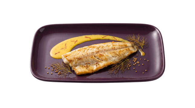Gourmet pan-seared white fish fillet with saffron sauce. Elegant seafood dish on purple plate. Fine dining fish entree with herbs.