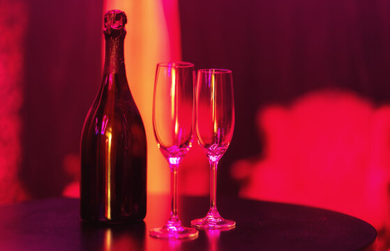 Champagne bottle and glasses in a nightclub.
