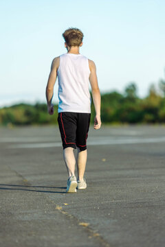 Teeange Boy In A Sleeveless Top And Shorts