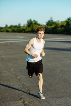 Teeange Boy In A Sleeveless Top And Shorts