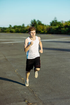 Teeange Boy In A Sleeveless Top And Shorts