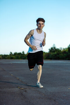 Teeange Boy In A Sleeveless Top And Shorts
