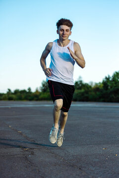 Teeange Boy In A Sleeveless Top And Shorts