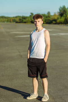 Teeange Boy In A Sleeveless Top And Shorts