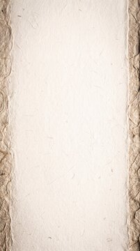 A textured, artisanal paper with a rough, organic edge features a clean, blank central panel, offering a minimalist and natural canvas for creative expression.