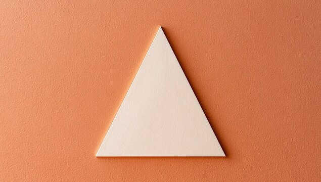 A geometric light-toned triangle positioned centrally on an orange background