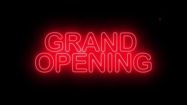 Grand opening neon sign glowing with dynamic animated light effects on dark background.